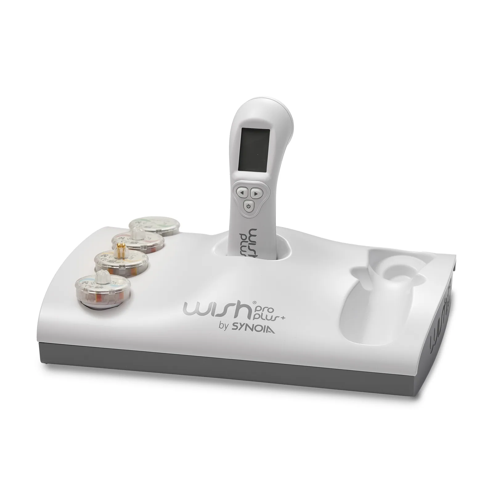 The WISHpro console with the handpiece docked and all four technology heads laid out beside it